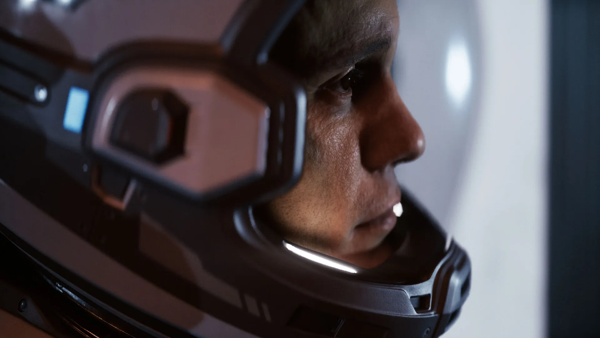 A close-up of a crew member inside their space helmet.